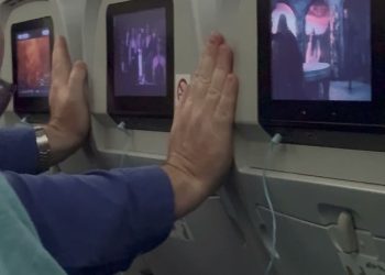 Plane passenger adopts ‘ridiculous’ position to stop seats in front reclining on eight-hour flight