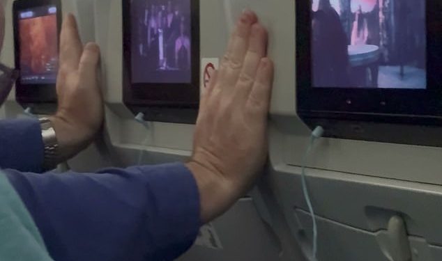 Plane passenger adopts ‘ridiculous’ position to stop seats in front reclining on eight-hour flight